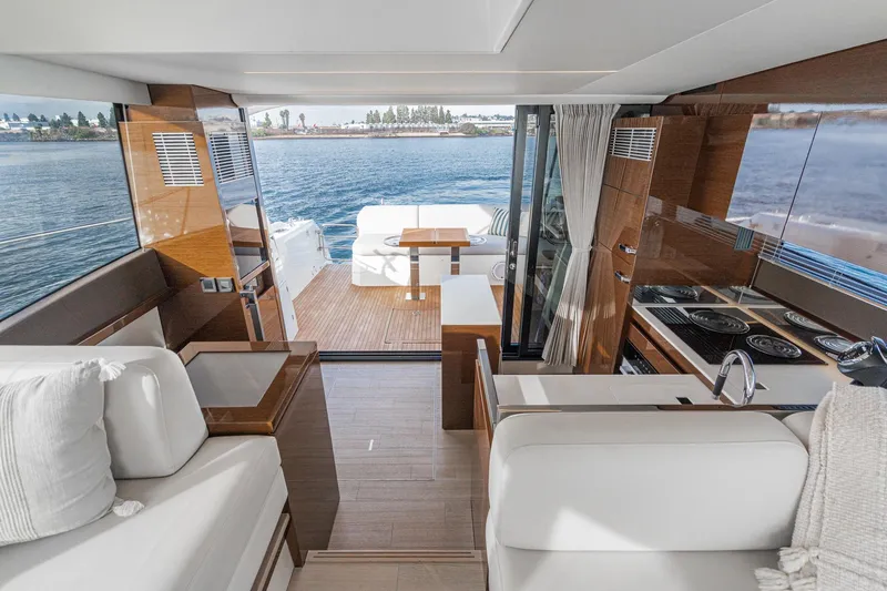 Slide: The Image of Luxurious interior of 2023 Prestige 520 yacht with modern kitchen and seating area. - 40