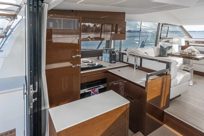 Slide: The Image of Luxurious interior of 2023 Prestige 520 yacht with modern kitchen and seating area. - 41