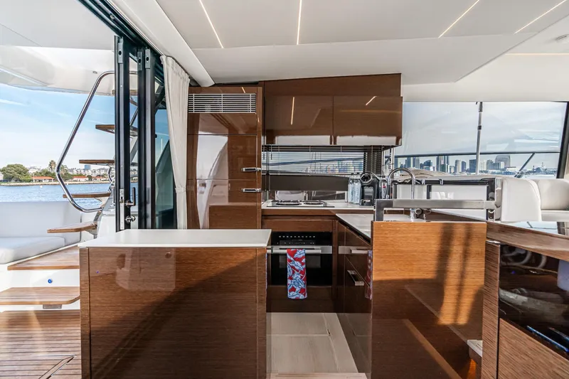 Slide: The Image of Luxurious interior of 2023 Prestige 520 yacht with modern kitchen and scenic water view. - 42