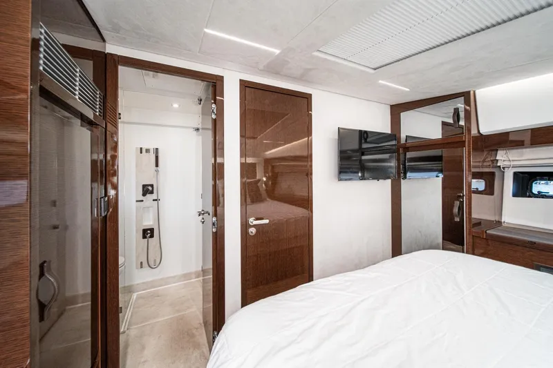 Slide: The Image of Luxurious interior of 2023 Prestige 520 yacht featuring modern bedroom and bathroom design. - 51