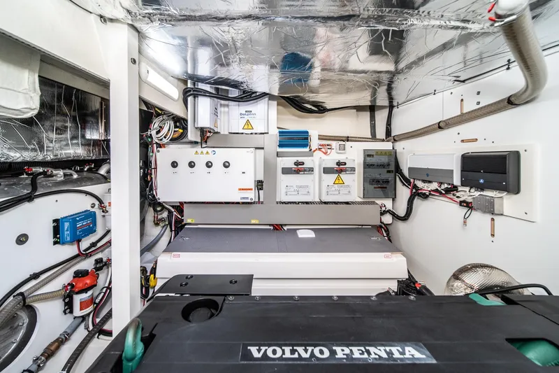Slide: The Image of Engine room of 2023 Prestige 520 yacht with Volvo Penta components and electrical systems. - 64