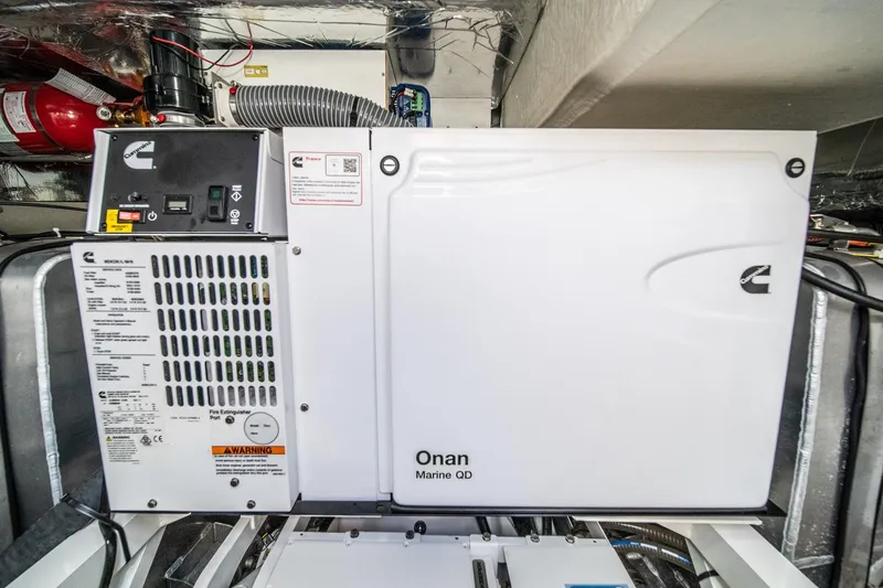 Slide: The Image of Cummins Onan Marine QD generator in a 2023 Prestige 520 yacht engine room. - 67