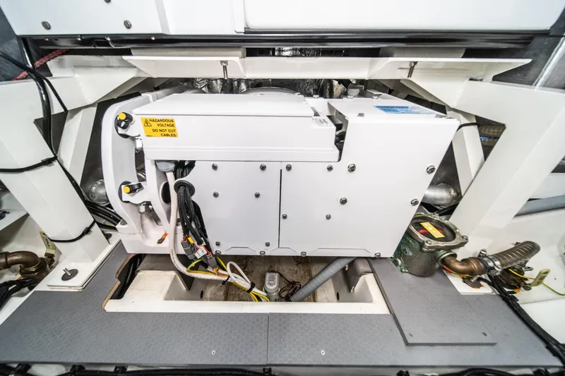 Slide: The Image of Engine compartment of 2023 Prestige 520 yacht, showcasing electrical components and wiring. - 68