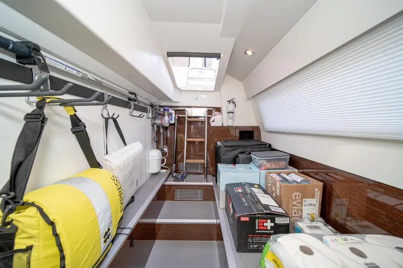 Slide: The Image of Interior storage area of 2023 Prestige 520 yacht, featuring organized equipment and supplies. - 71