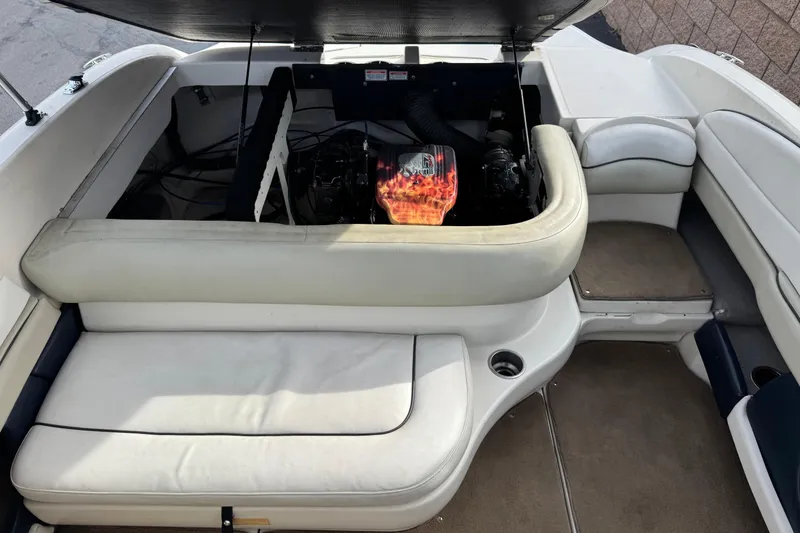 Slide: The Image of 2006 Sea Ray 220 Select boat interior with open engine compartment. - 17