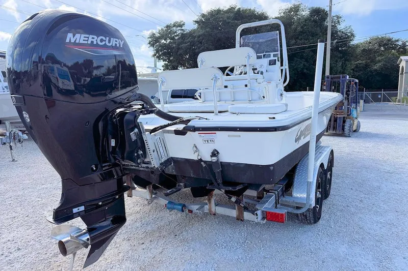 Slide: The Image of 2019 Mako 21 LTS boat with Mercury outboard engine on trailer. - 2