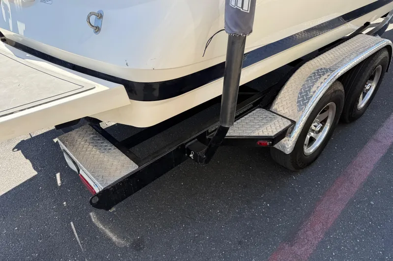 Slide: The Image of 2007 MasterCraft X-15 boat on a dual-axle trailer with diamond plate fenders. - 10