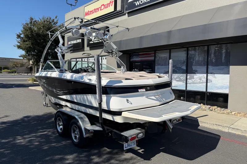 Slide: The Image of 2007 MasterCraft X-15 boat on trailer outside dealership, rear view. - 3