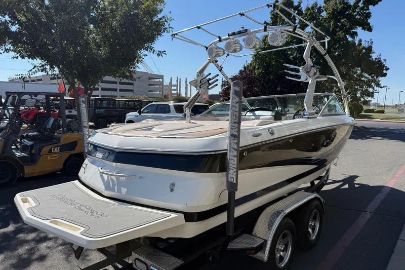 Slide: The Image of 2007 MasterCraft X-15 boat on trailer, parked outdoors in a sunny area. - 5
