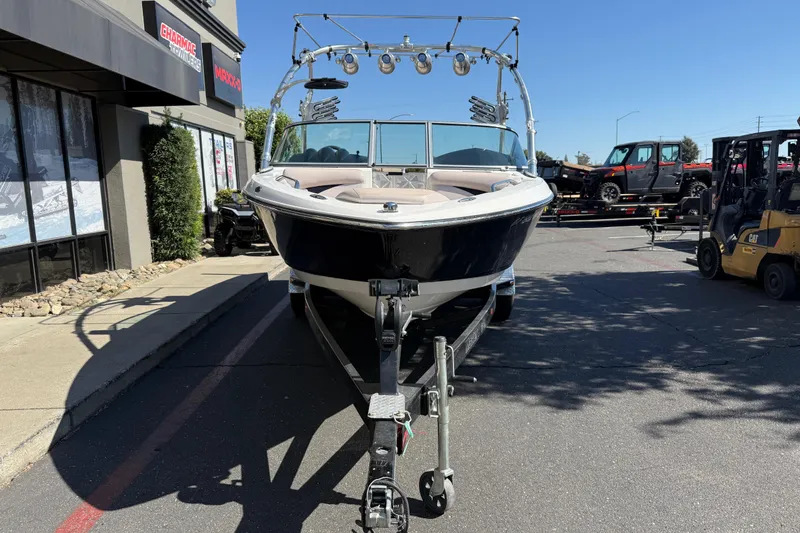 Slide: The Image of 2007 MasterCraft X-15 boat on trailer, parked outside dealership on sunny day. - 7