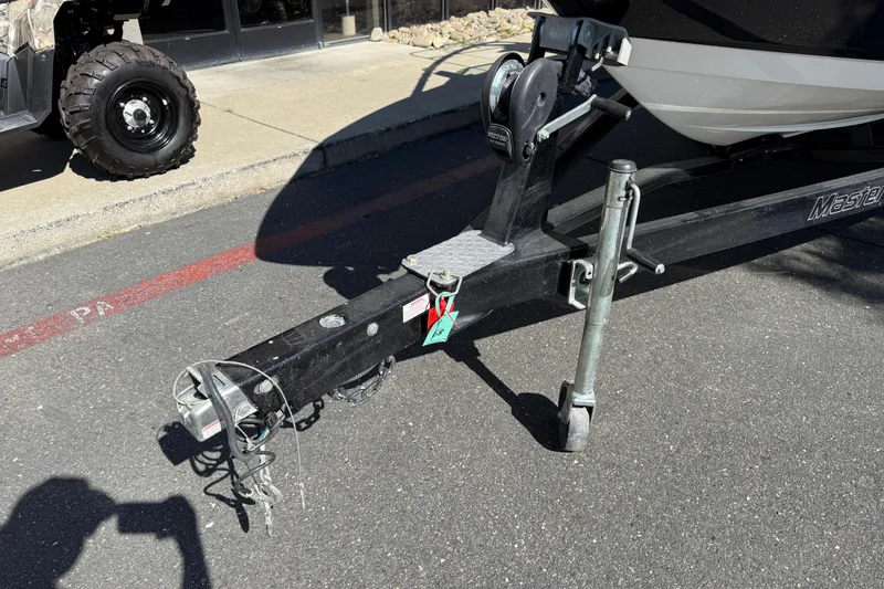 Slide: The Image of Trailer hitch of a 2007 MasterCraft X-15 boat on pavement. - 8