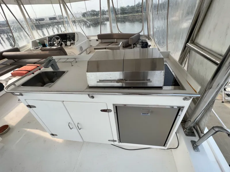 Slide: The Image of Helm of 2016 Leopard 51 Powercat with Raymarine navigation equipment and steering wheel. - 10