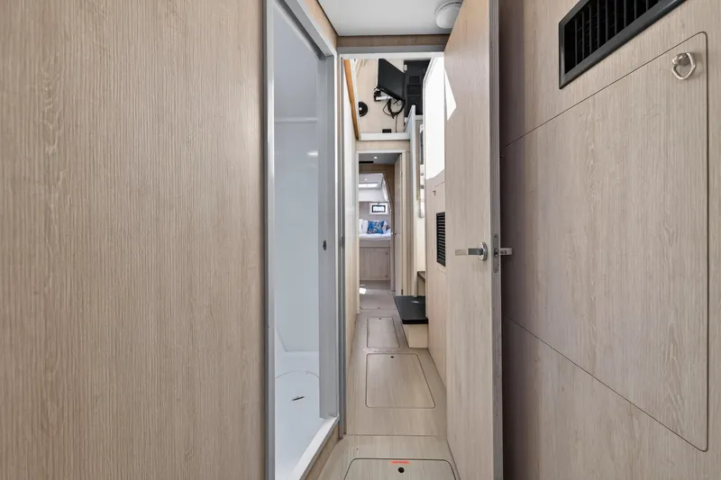 Slide: The Image of Interior hallway of 2016 Leopard 51 Powercat yacht with modern wood paneling. - 100