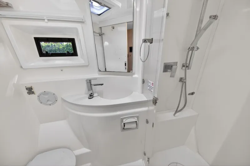 Slide: The Image of Bathroom interior of 2016 Leopard 51 Powercat, featuring modern fixtures and sleek design. - 101