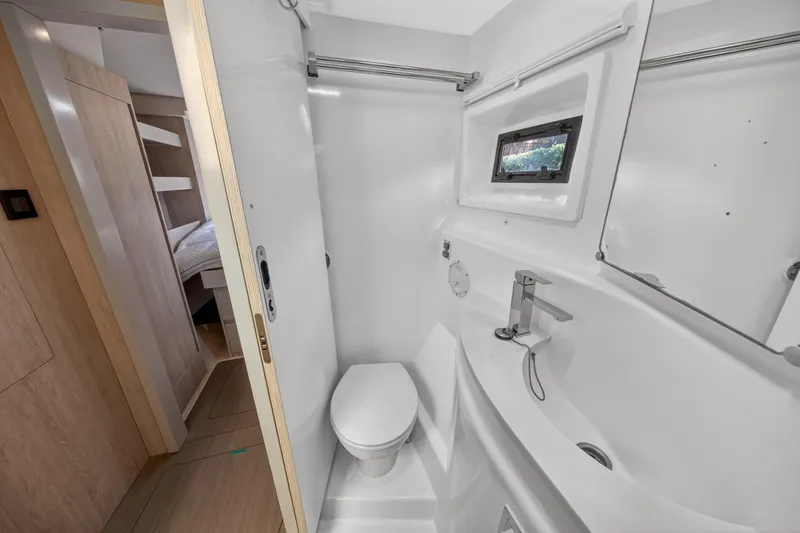 Slide: The Image of Modern bathroom on 2016 Leopard 51 Powercat yacht with compact design and window. - 102