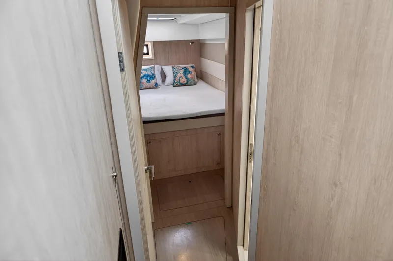Slide: The Image of Cabin interior of 2016 Leopard 51 Powercat with cozy bed and decorative pillows. - 106