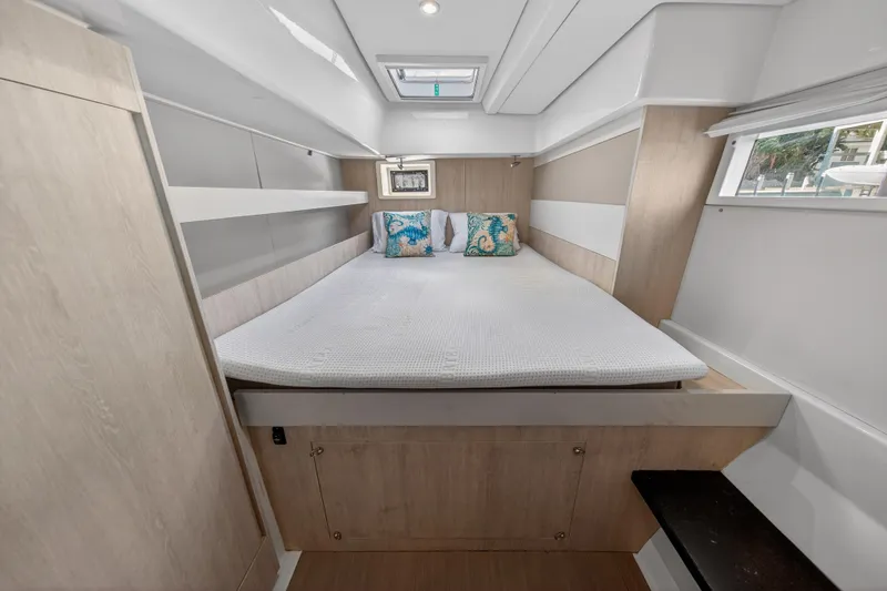 Slide: The Image of Cozy bedroom in 2016 Leopard 51 Powercat yacht with modern decor and natural light. - 114