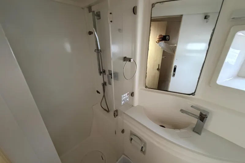 Slide: The Image of Bathroom interior of 2016 Leopard 51 Powercat with shower and sink. - 24