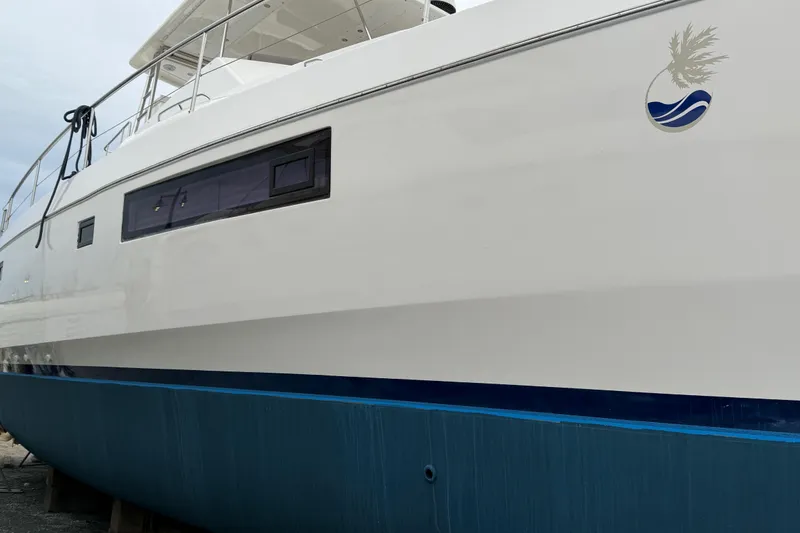 Slide: The Image of 2016 Leopard 51 Powercat yacht with sleek white hull and modern design. - 30