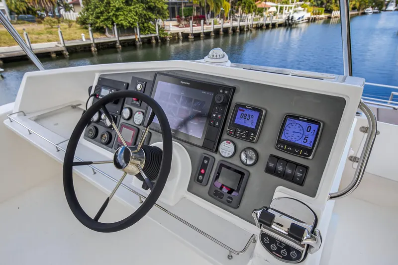 Slide: The Image of Helm of 2016 Leopard 51 Powercat with navigation instruments and steering wheel. - 37