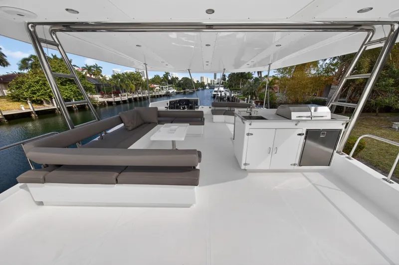Slide: The Image of Spacious deck of 2016 Leopard 51 Powercat with seating and outdoor kitchen. - 43