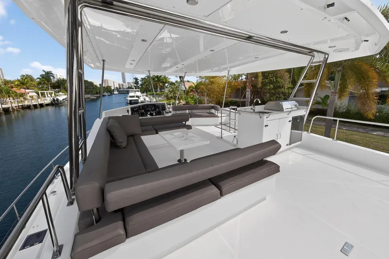 Slide: The Image of Luxurious 2016 Leopard 51 Powercat yacht with spacious deck and modern seating area. - 44