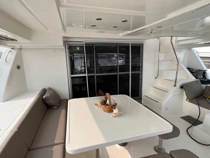 Slide: The Image of 2016 Leopard 51 Powercat in harbor, front view with seating area. - 5