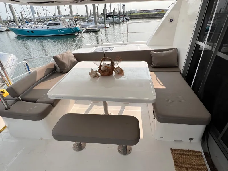 Slide: The Image of 2016 Leopard 51 Powercat yacht deck view at marina with surrounding boats. - 6