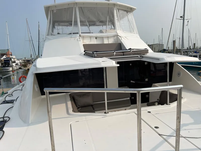Slide: The Image of Spacious deck of 2016 Leopard 51 Powercat with seating and kitchenette. - 7