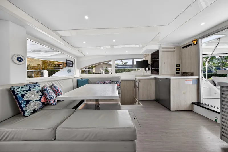 Slide: The Image of Luxurious interior of 2016 Leopard 51 Powercat yacht with modern seating and kitchen area. - 72