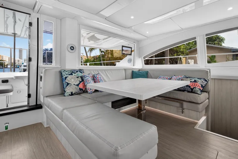 Slide: The Image of Luxurious interior of 2016 Leopard 51 Powercat with plush seating and decorative pillows. - 79
