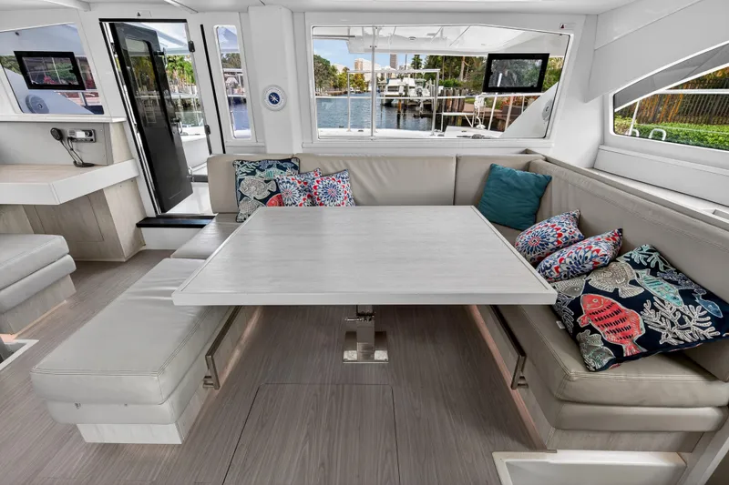 Slide: The Image of Interior of 2016 Leopard 51 Powercat with modern seating and colorful cushions. - 81