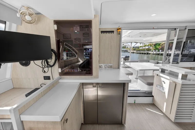 Slide: The Image of Interior of 2016 Leopard 51 Powercat yacht with modern kitchen and outdoor seating area. - 83