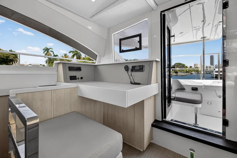Slide: The Image of Interior of 2016 Leopard 51 Powercat yacht with modern seating and control panel. - 88