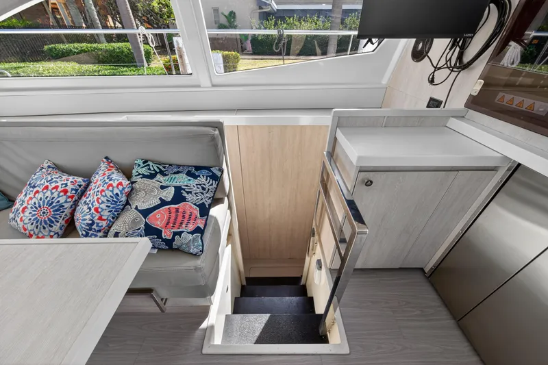 Slide: The Image of 2016 Leopard 51 Powercat interior with colorful cushions and sleek staircase. - 89