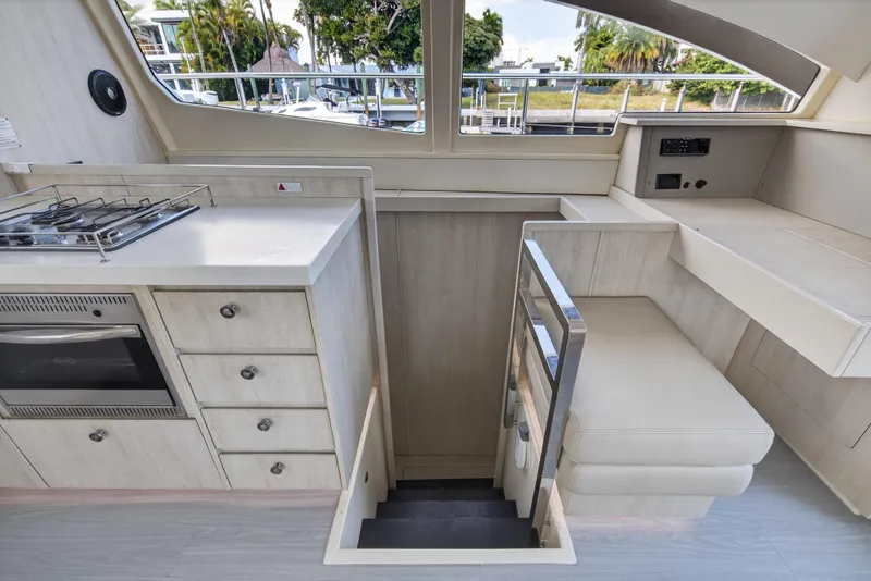 Slide: The Image of Interior of 2016 Leopard 51 Powercat yacht with kitchen and seating area. - 90