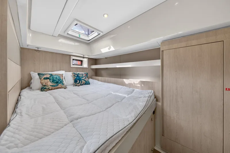 Slide: The Image of Cozy bedroom in 2016 Leopard 51 Powercat with skylight and decorative pillows. - 95