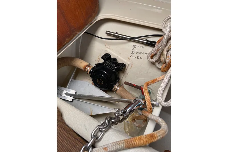 Slide: The Image of Interior of a 1992 Dragonfly 800 Swing Wing sailboat with ropes and mechanical components. - 10