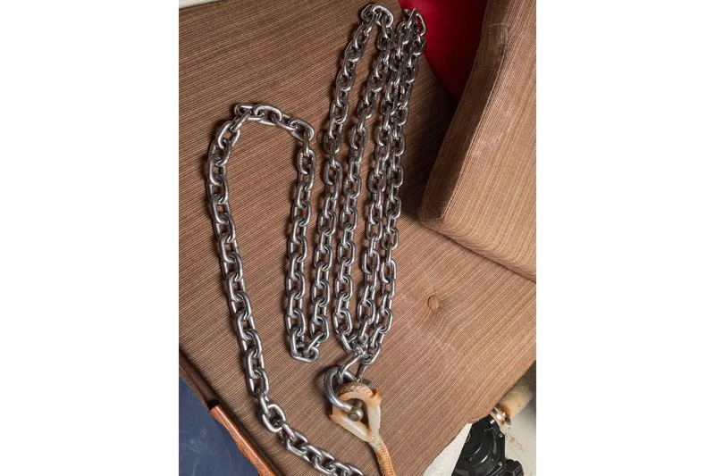 Slide: The Image of Heavy-duty metal chain on a brown fabric surface, Dragonfly 800 Swing Wing 1992. - 11