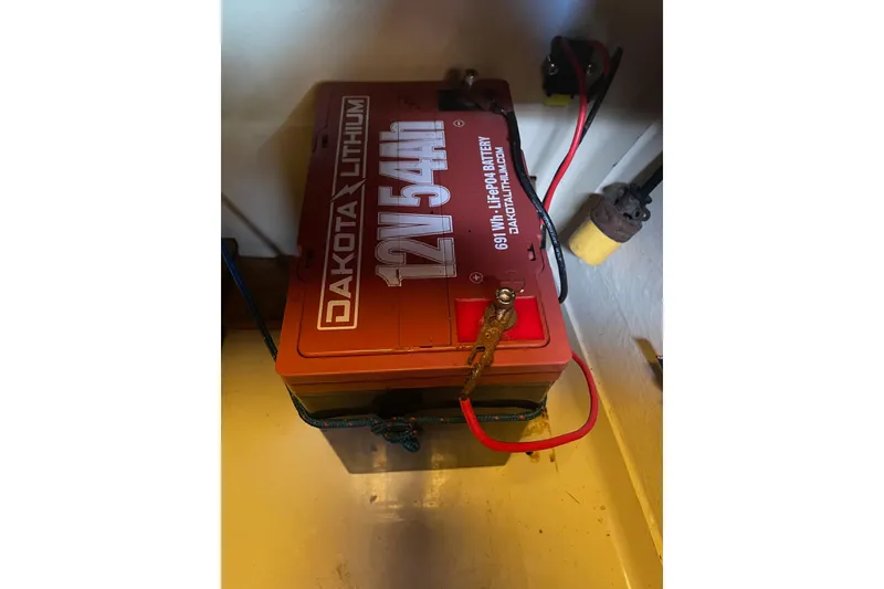 Slide: The Image of Dakota Lithium 12V 54Ah battery installed in Dragonfly 800 Swing Wing, 1992 model. - 12