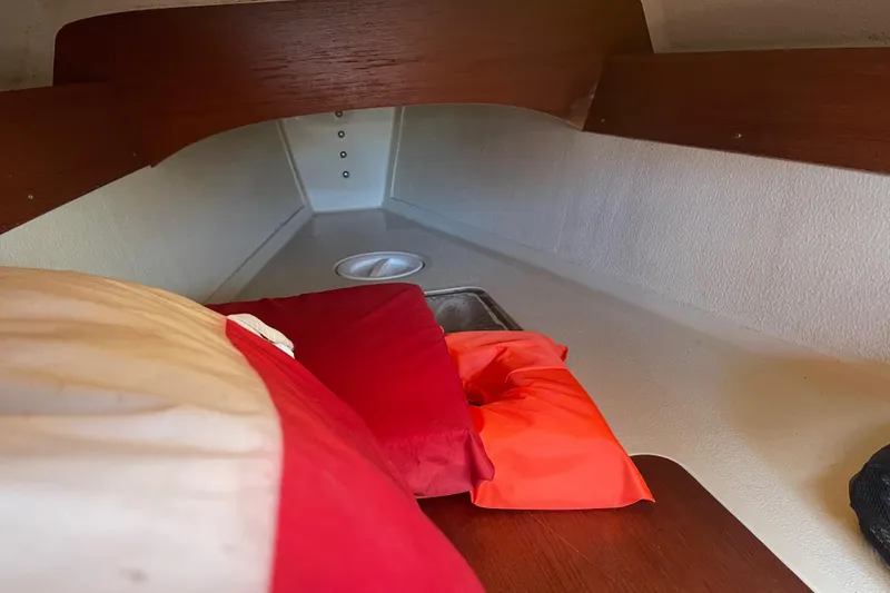 Slide: The Image of Cozy cabin interior of 1992 Dragonfly 800 Swing Wing sailboat with cushions. - 17