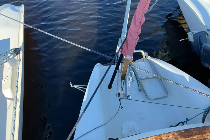 Slide: The Image of Sailboat deck view, Dragonfly 800 Swing Wing, 1992, moored on calm water. - 29