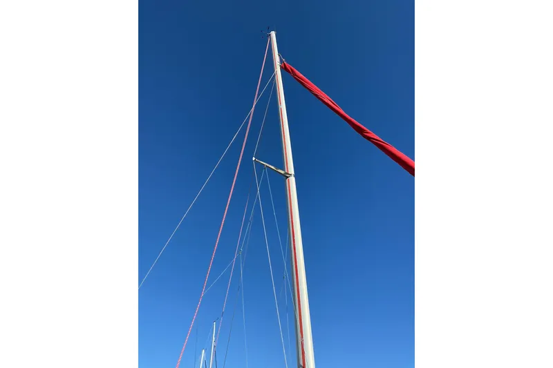 Slide: The Image of Tall sailboat mast against clear blue sky, Dragonfly 800 Swing Wing, 1992 model. - 43