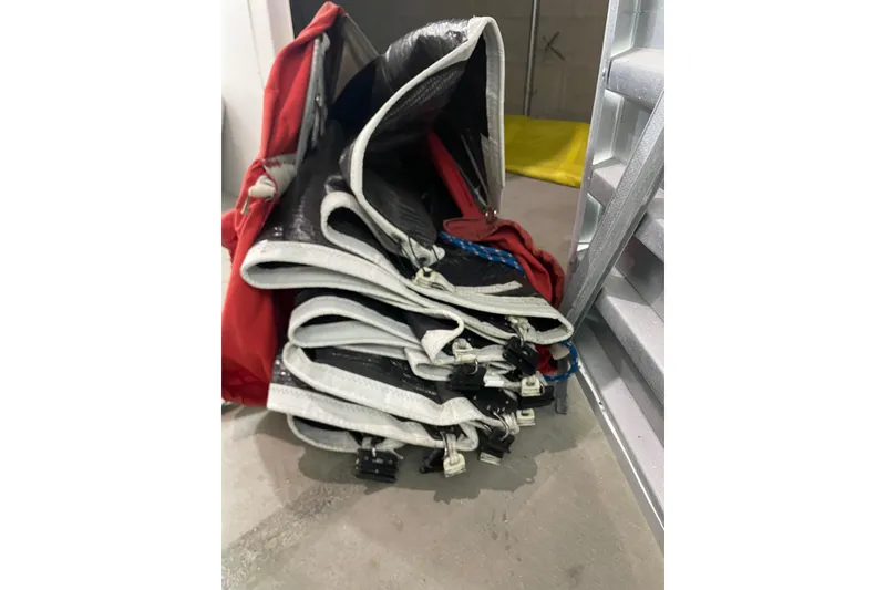 Slide: The Image of Folded sail of a 1992 Dragonfly 800 Swing Wing, stored indoors. - 58