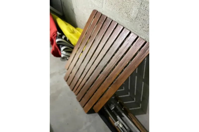 Slide: The Image of Wooden slatted seat of a 1992 Dragonfly 800 Swing Wing, stored in a garage. - 67