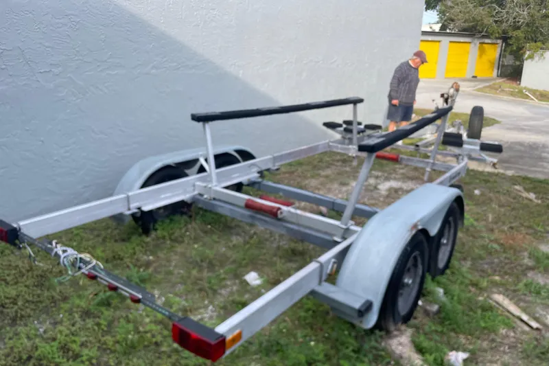 Slide: The Image of Trailer for Dragonfly 800 Swing Wing, 1992 model, parked outdoors near a building. - 70