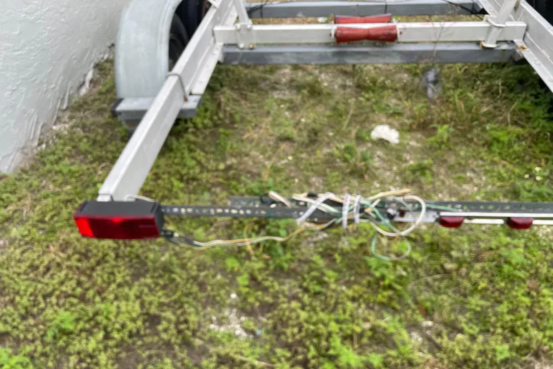 Slide: The Image of Trailer hitch of a 1992 Dragonfly 800 Swing Wing on grassy ground. - 72