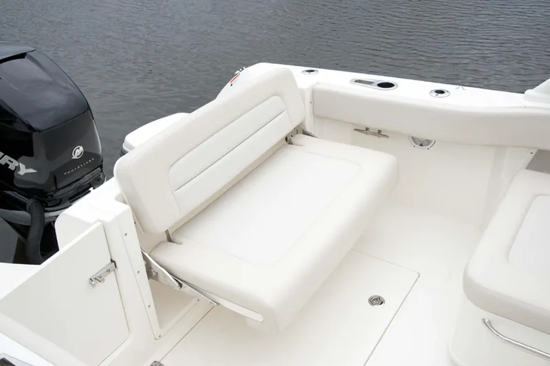 Slide: The Image of Manufacturer Provided Image: 2016 Boston Whaler 230 Vantage boat with cushioned seating and outboard motor. - 20