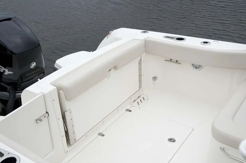 Slide: The Image of Manufacturer Provided Image: 2016 Boston Whaler 230 Vantage boat interior with seating and outboard motor. - 21