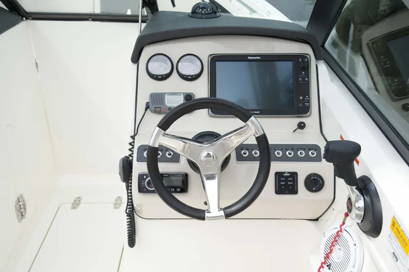 Slide: The Image of 2016 Boston Whaler 230 Vantage boat interior, featuring spacious seating and storage. - 8